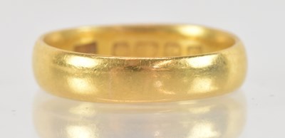 Lot 1308 - A 22ct yellow gold wedding band, size J,...