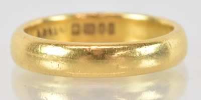 Lot 1268 - A 22ct yellow gold wedding band, size L,...