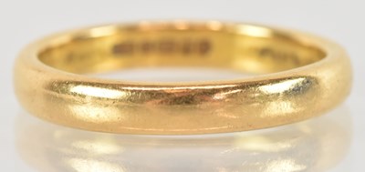 Lot 1269 - A 22ct yellow gold wedding band, size P,...