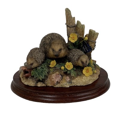 Lot 606 - BORDER FINE ARTS; a figural group of hedgehogs,...