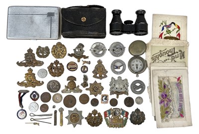 Lot 397 - A quantity of military badges, buttons and cap...