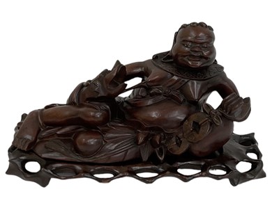 Lot 1039 - A Chinese carved rootwood figure of a...