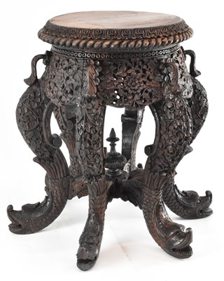 Lot 1015 - A profusely carved Anglo-Indian hardwood...