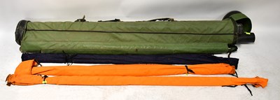 Lot 486 - Four fishing rods in canvas cases, four...