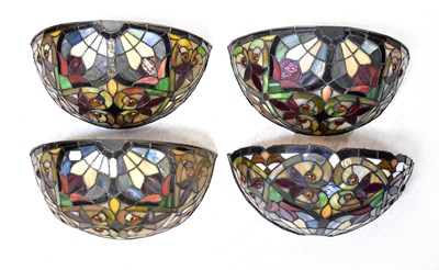 Lot 117 - A set of four Tiffany-style leaded glass wall...