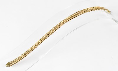 Lot 622 - A 9ct yellow gold double curb link bracelet,...