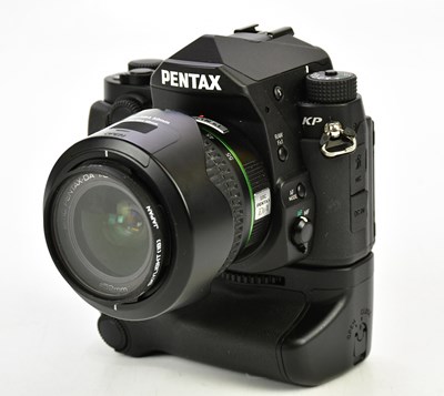 Lot 1167 - PENTAX; a Pentax KP DLSR camera, with a Pentax...