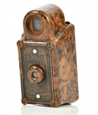 Lot 1183 - A Coronet midget miniature camera, in mottled...