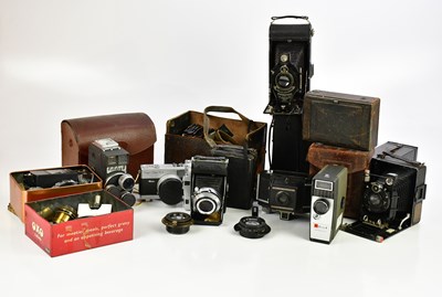 Lot 1187 - A collection of cameras and accessories, to...