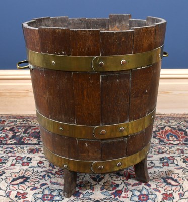 Lot 2804 - A brass bound coopered oak log bucket, with...