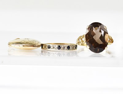 Lot 619 - Two 9ct yellow gold dress rings, comprising...