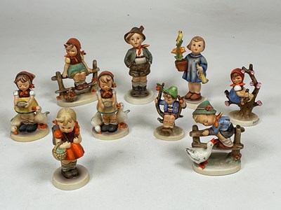 Lot 239 - GOEBEL: nine ceramic figures of children in...