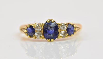 Lot 1190 - An 18ct yellow gold sapphire and diamond ring...