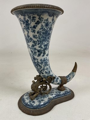 Lot 184 - A large blue and white floral decorated brass...