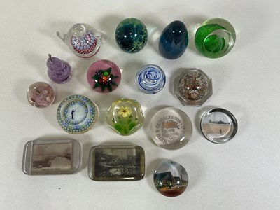 Lot 254 - Sixteen glass paperweights in various forms...