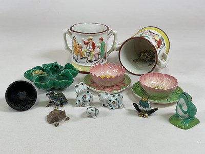 Lot 214 - A group of frog related ceramics including two...