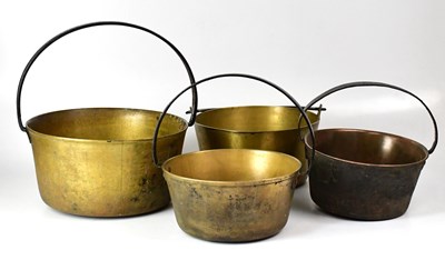 Lot 432 - Four brass jam pans, three with fixed wrought...