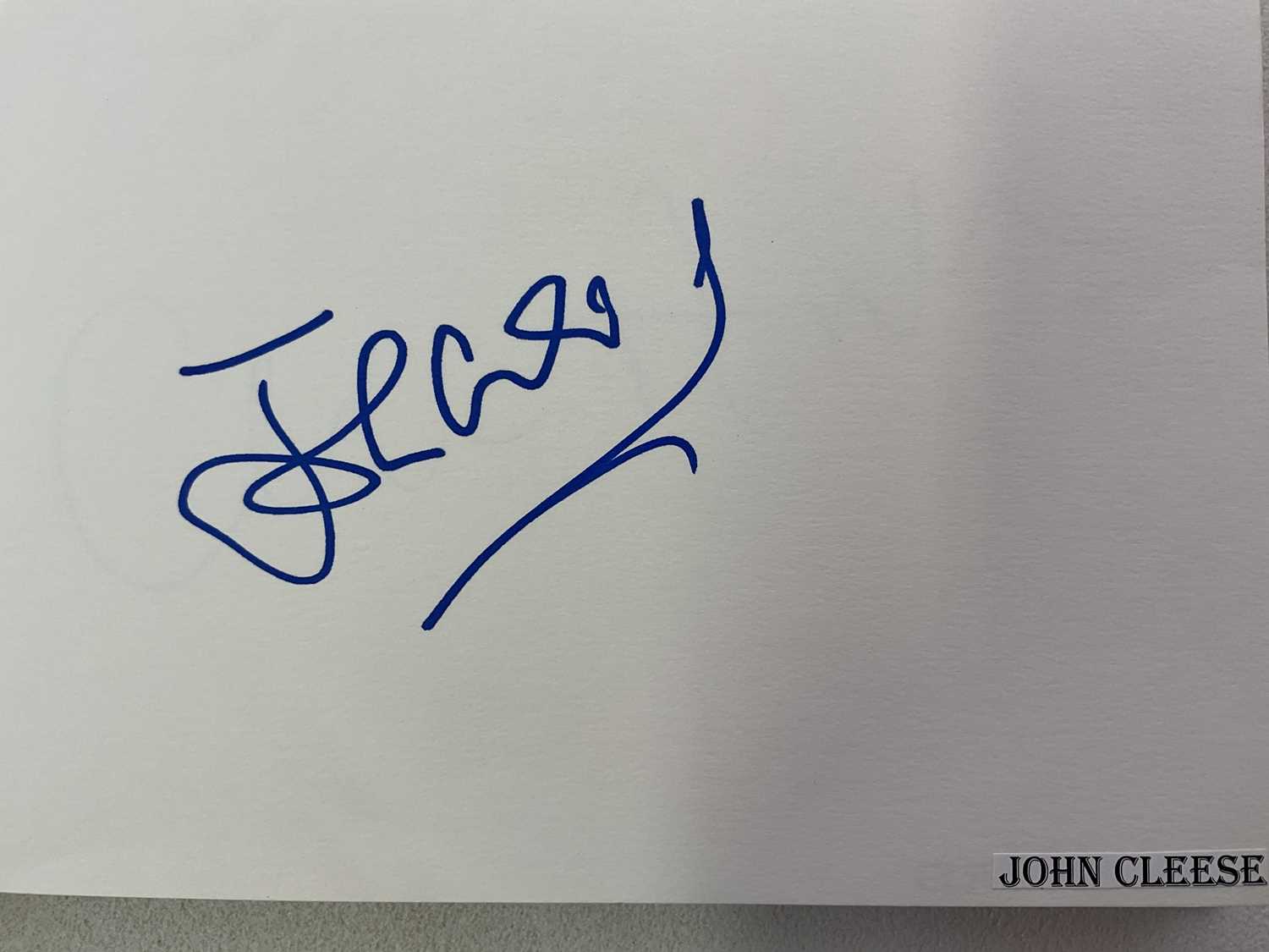 Lot 1567 - An autograph album containing signed pages for...