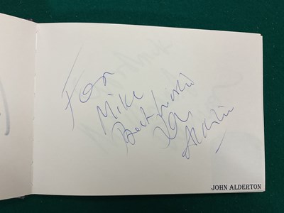 Lot 1567 - An autograph album containing signed pages for...