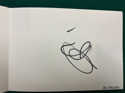Lot 1567 - An autograph album containing signed pages for...