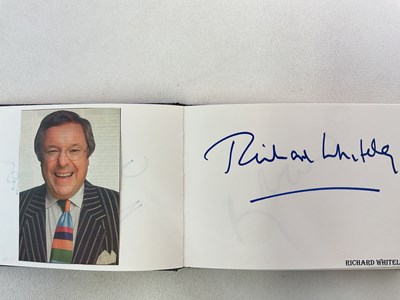 Lot 1567 - An autograph album containing signed pages for...