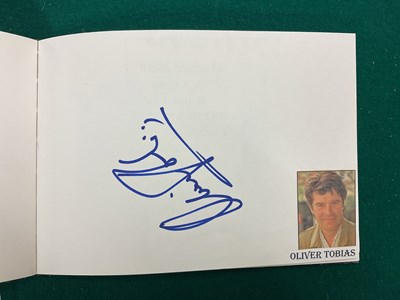 Lot 1567 - An autograph album containing signed pages for...