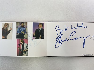 Lot 1567 - An autograph album containing signed pages for...