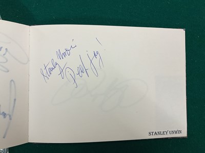 Lot 1567 - An autograph album containing signed pages for...