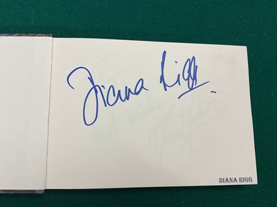Lot 1567 - An autograph album containing signed pages for...