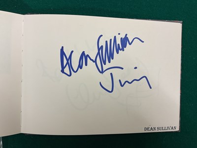 Lot 1567 - An autograph album containing signed pages for...