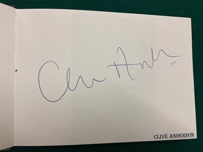 Lot 1567 - An autograph album containing signed pages for...