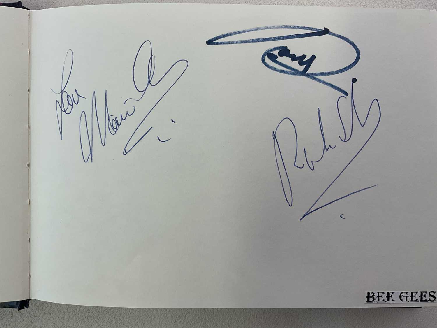 Lot 1594 - An autograph album with pages signed by...