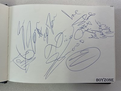 Lot 1594 - An autograph album with pages signed by...