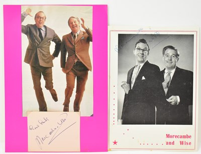 Lot 1658 - MORECAMBE & WISE; a colour print of the duo...