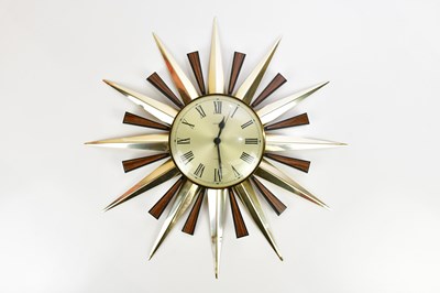 Lot 683 - METAMEK; a mid century style sunburst clock,...