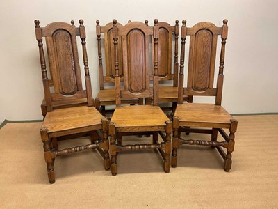 Lot 148 - Six reproduction oak dining chairs with arched...