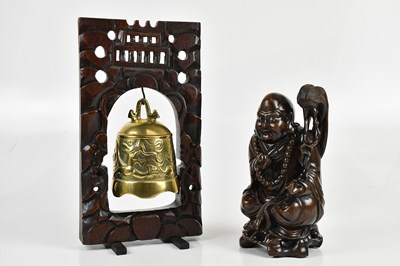 Lot 1113 - A Chinese brass bell on hardwood stand, height...