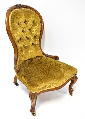 Lot 16 - A Victorian walnut button back nursing chair...