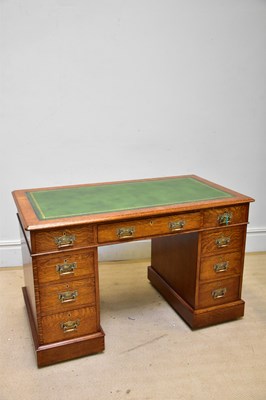 Lot 123 - An Edwardian oak pedestal desk, with an...