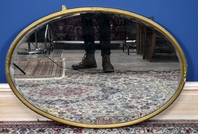 Lot 3028 - A gilt framed oval wall mirror with bevelled...