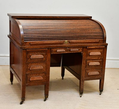 Lot 86 - An Edwardian oak roll top desk, with tambour...