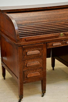 Lot 86 - An Edwardian oak roll top desk, with tambour...