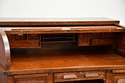 Lot 86 - An Edwardian oak roll top desk, with tambour...