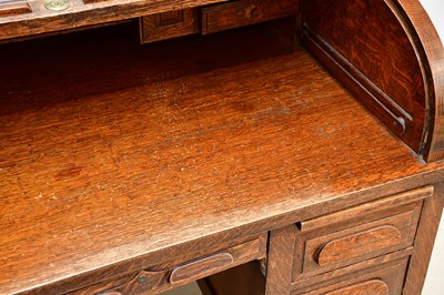 Lot 86 - An Edwardian oak roll top desk, with tambour...