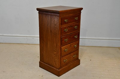 Lot 88 - A light oak pillar chest with five drawers, on...