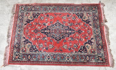 Lot 2685 - An Eastern rug with stylised floral detail on...