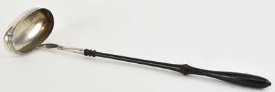 Lot 1174 - A white metal toddy ladle with turned ebony...