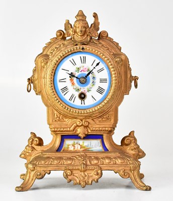 Lot 122 - A 19th century French mantel clock with Sèvres-...