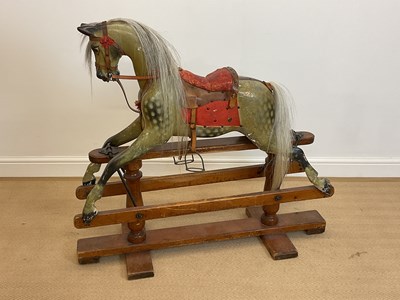 Lot 72 - A painted rocking horse on trestle base, with...