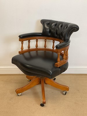 Lot 822 - A button leather upholstered and spindle back...